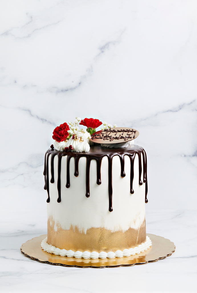 The signature Conche cake with dripping chocolate around the edges