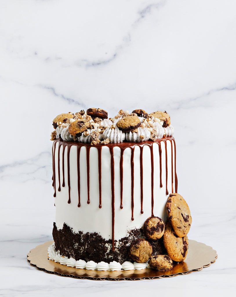 Cookie dream cake with chocolate drip and cookies on the top and sides