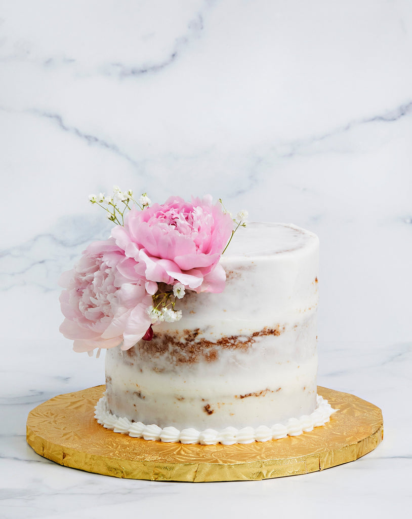 Simple naked cake with pink flowers